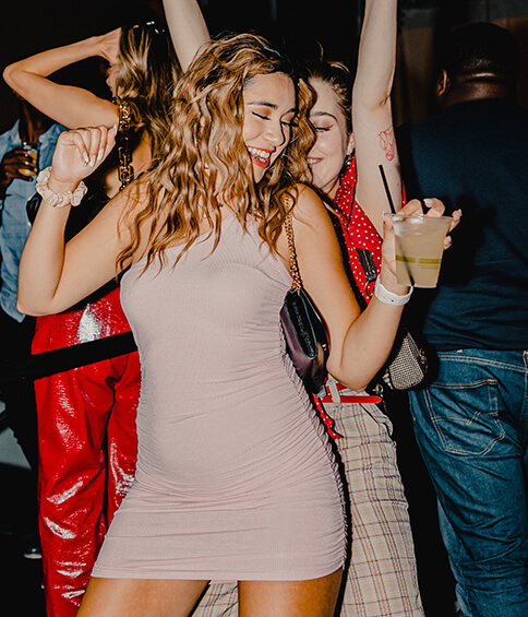 young woman dancing with friends